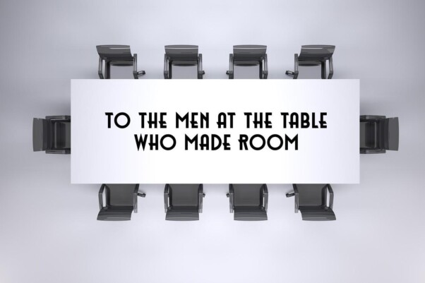 to the men at the table who have made room